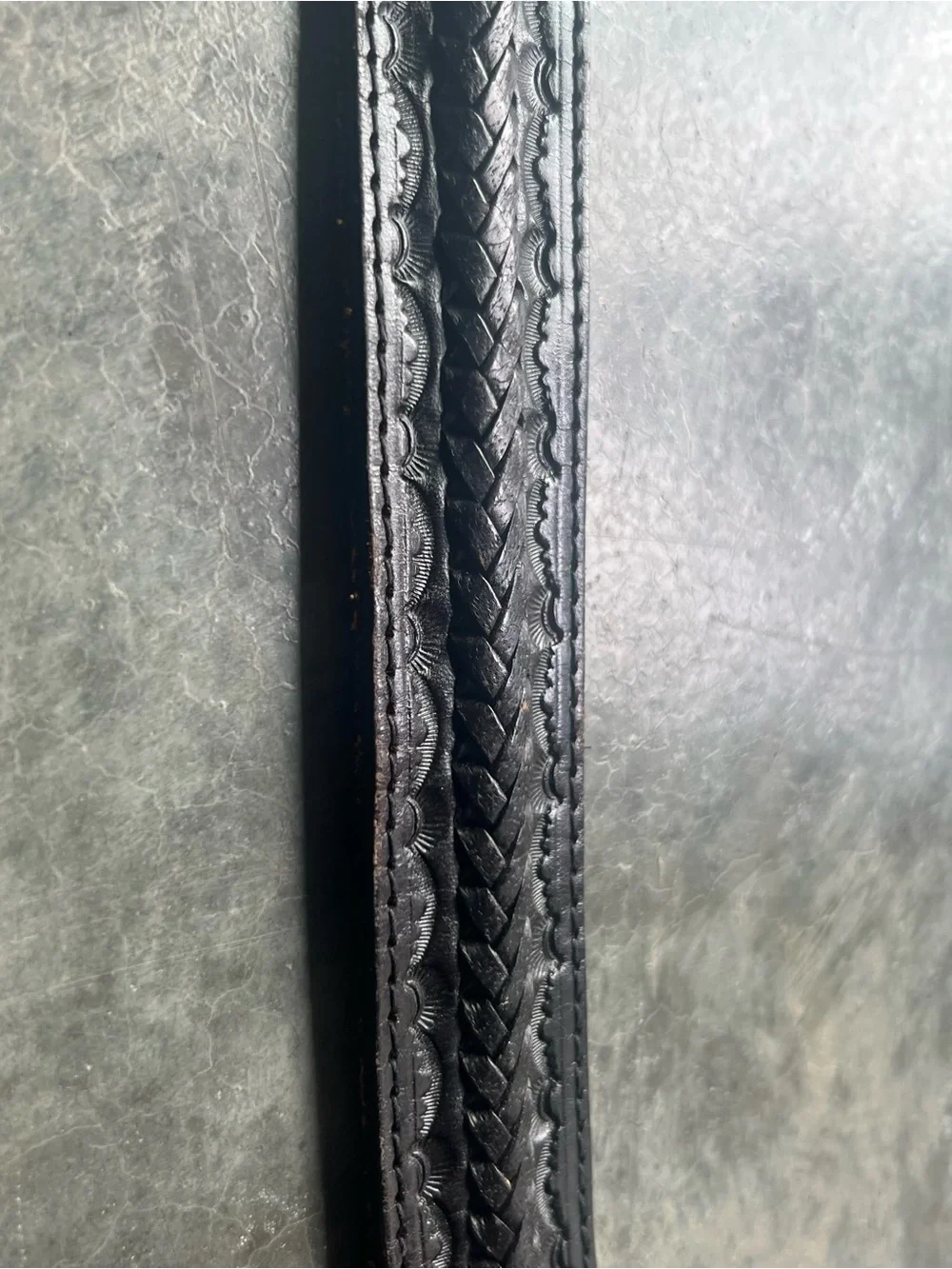 Vintage Levi's black tooled leather western belt with rotating harness buckle